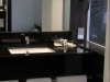 Sink area with complimentary water and toiletries