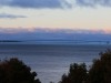 The sun is setting on Mackinac Bridge