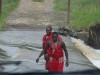 Offbeat guides checking bridge safety before crossing